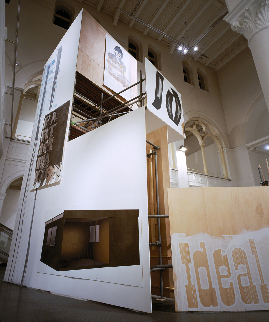 Daniela Brahm Highrise, 2005 spatial structure of scaffolding and plywood combining backstage material, text and paintings